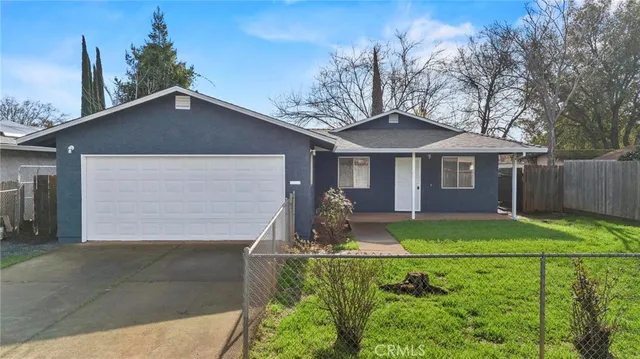 an aerial view of a house with a yard