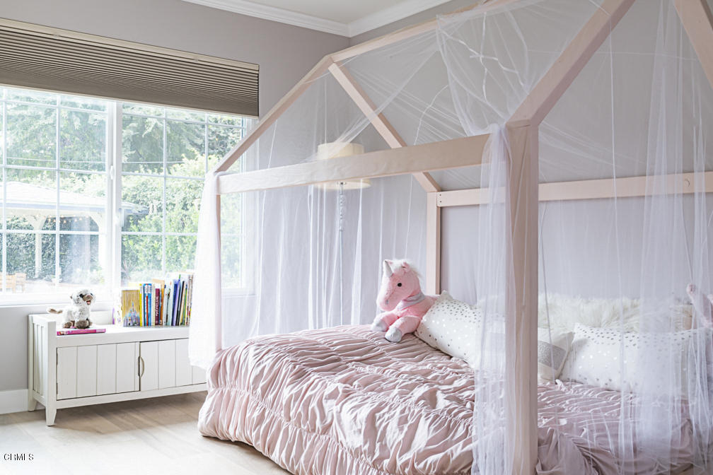 3710 Hampton Road Pasadena, CA 91107 - Photo 28 of 42 a bed sitting in a bedroom next to a window