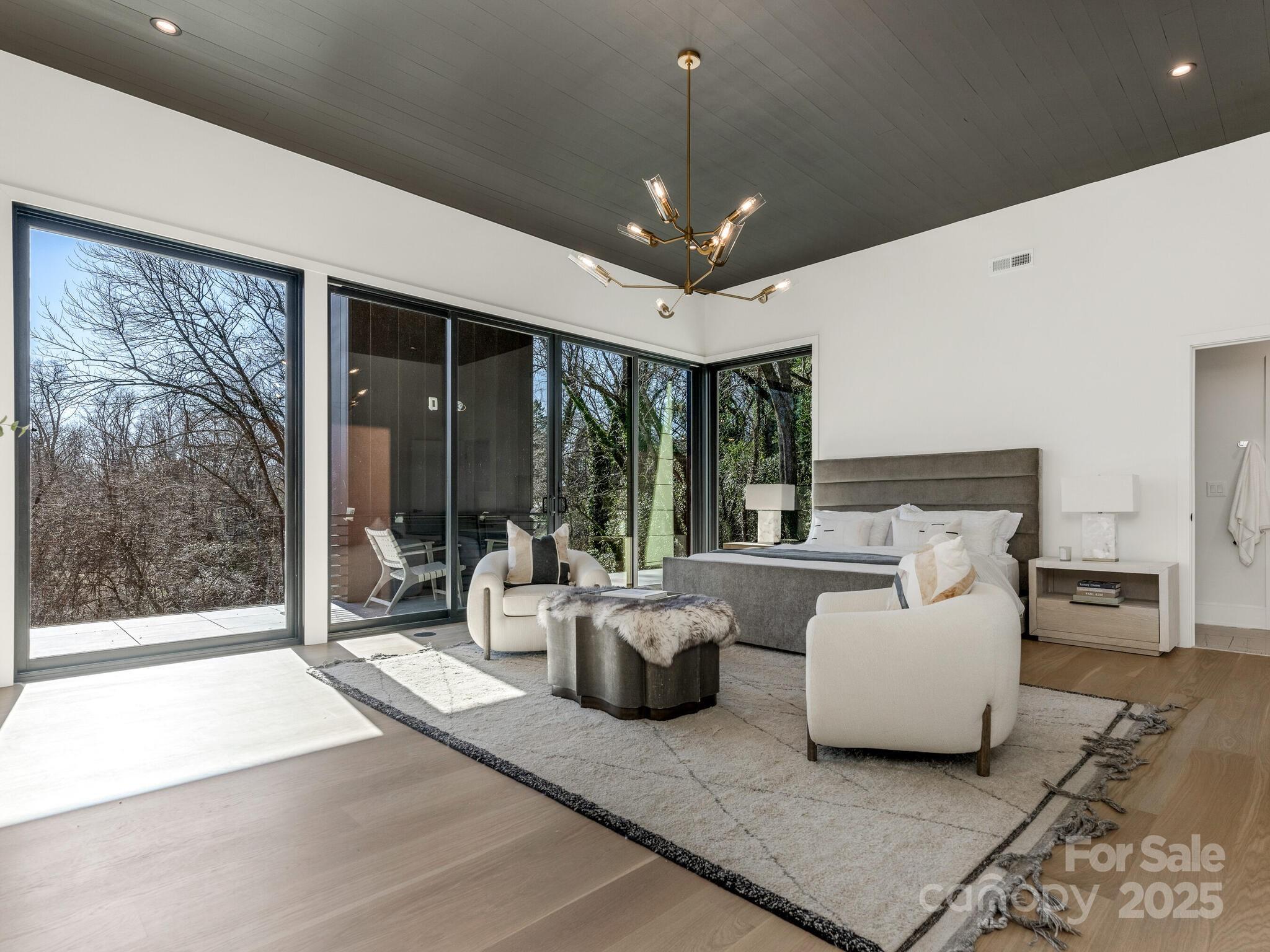 2832 Arcadia Avenue Charlotte, NC 28209 - Photo 21 of 48 a living room with furniture and large windows
