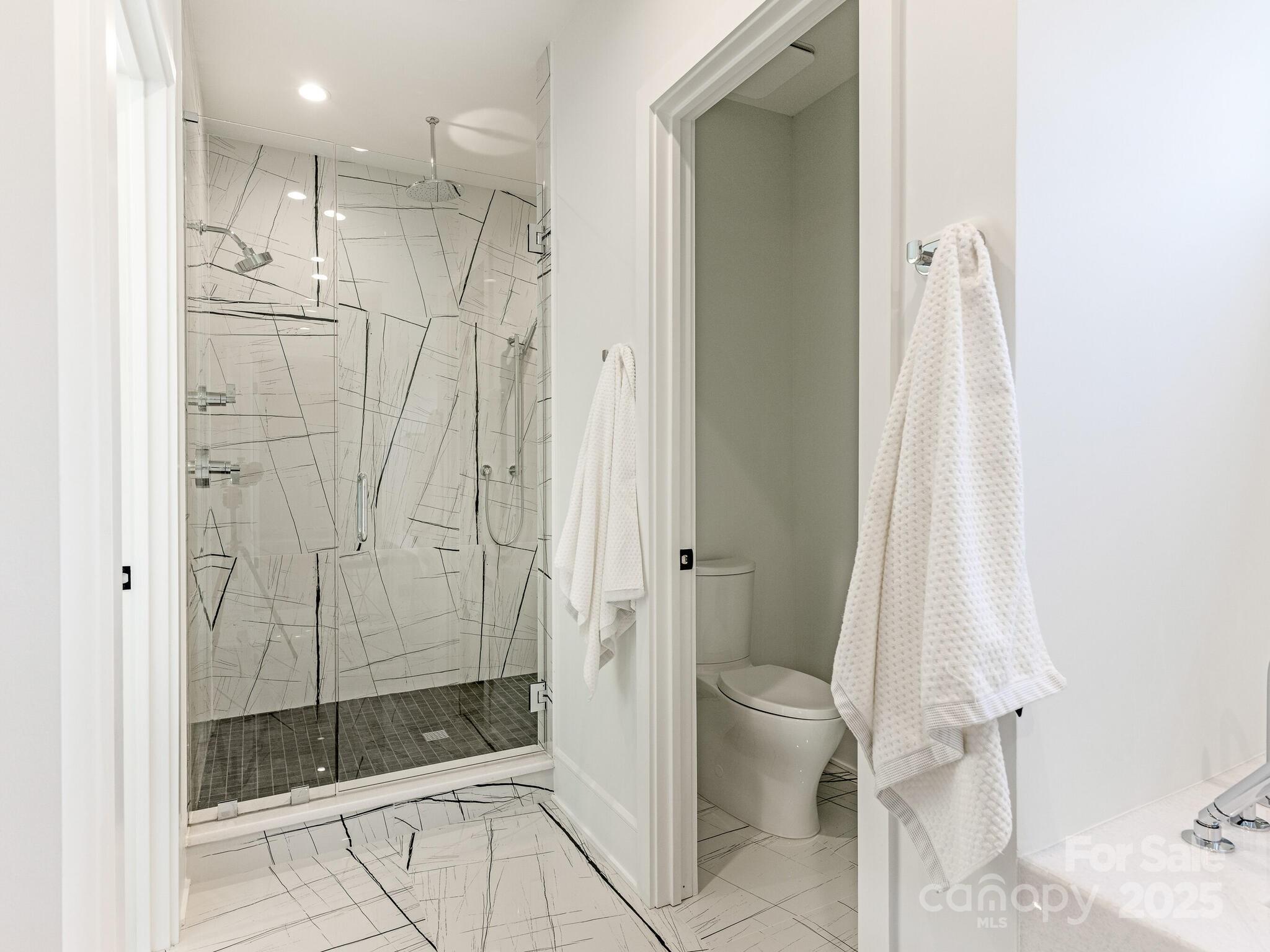 2832 Arcadia Avenue Charlotte, NC 28209 - Photo 23 of 48 a bathroom with a shower and a toilet
