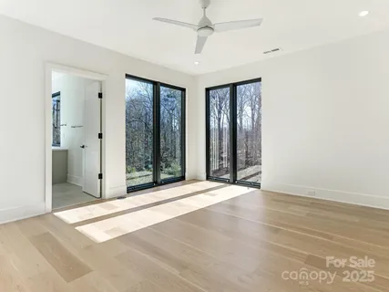 a view of an empty room with glass door
