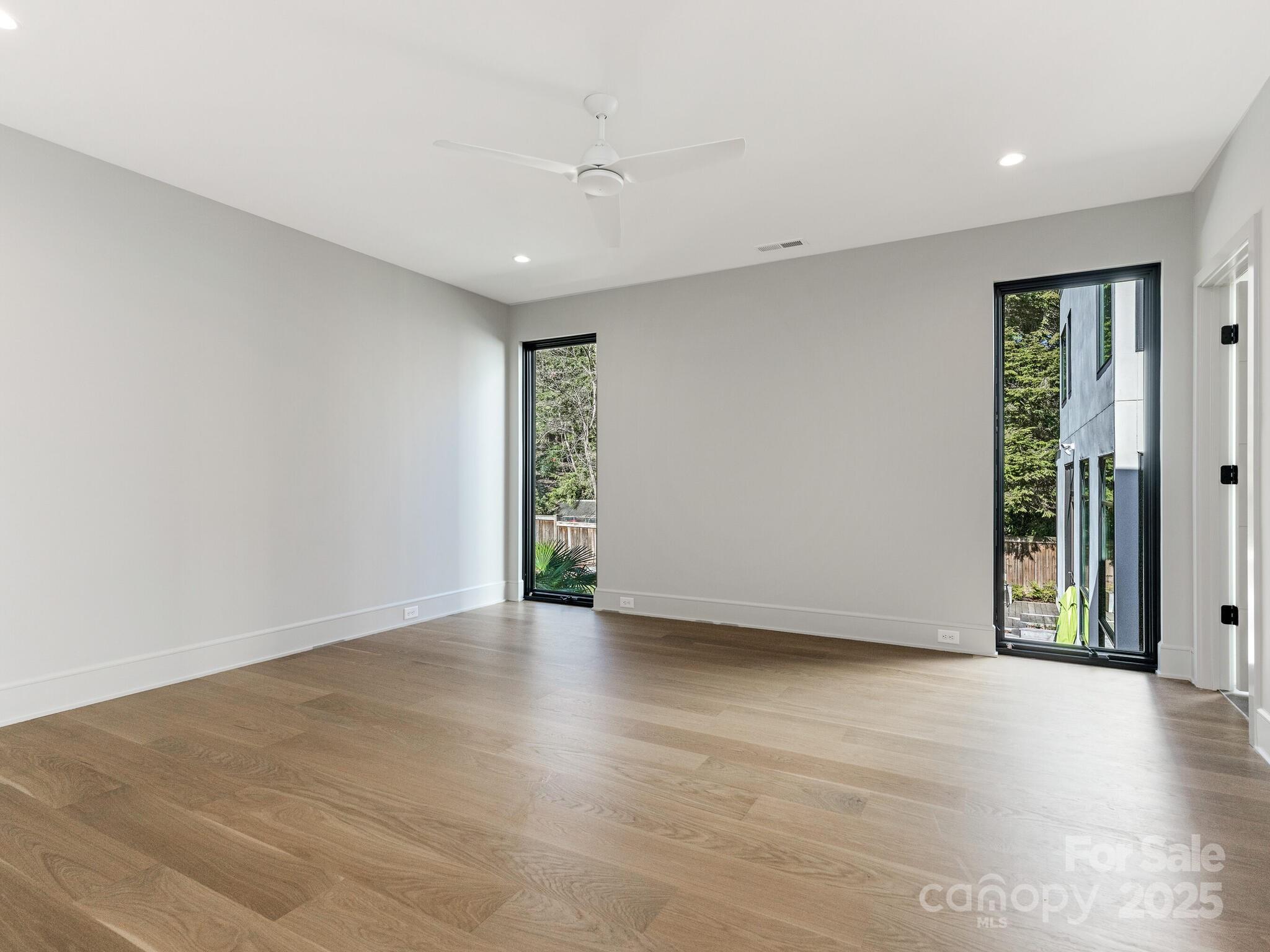 2832 Arcadia Avenue Charlotte, NC 28209 - Photo 28 of 48 a view of an empty room with wooden floor