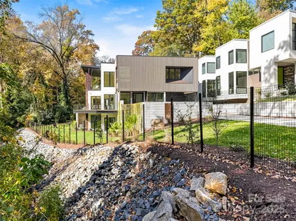 a view of a house with a backyard and a garden