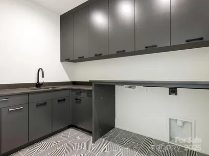 a kitchen with a sink and cabinets