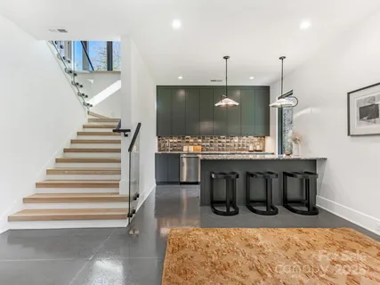 a view of kitchen with furniture and wooden floor