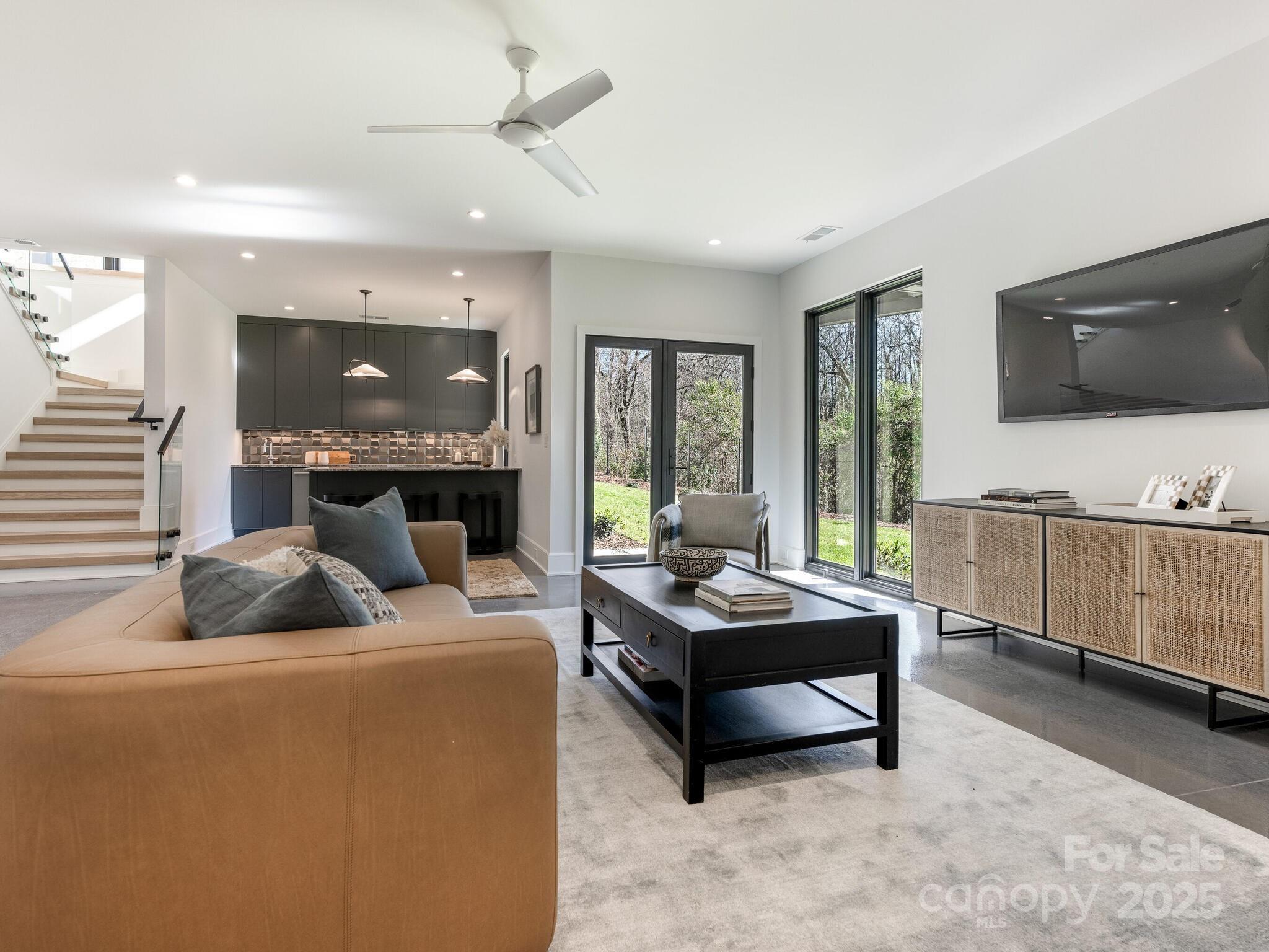 2832 Arcadia Avenue Charlotte, NC 28209 - Photo 35 of 48 a living room with furniture and a flat screen tv