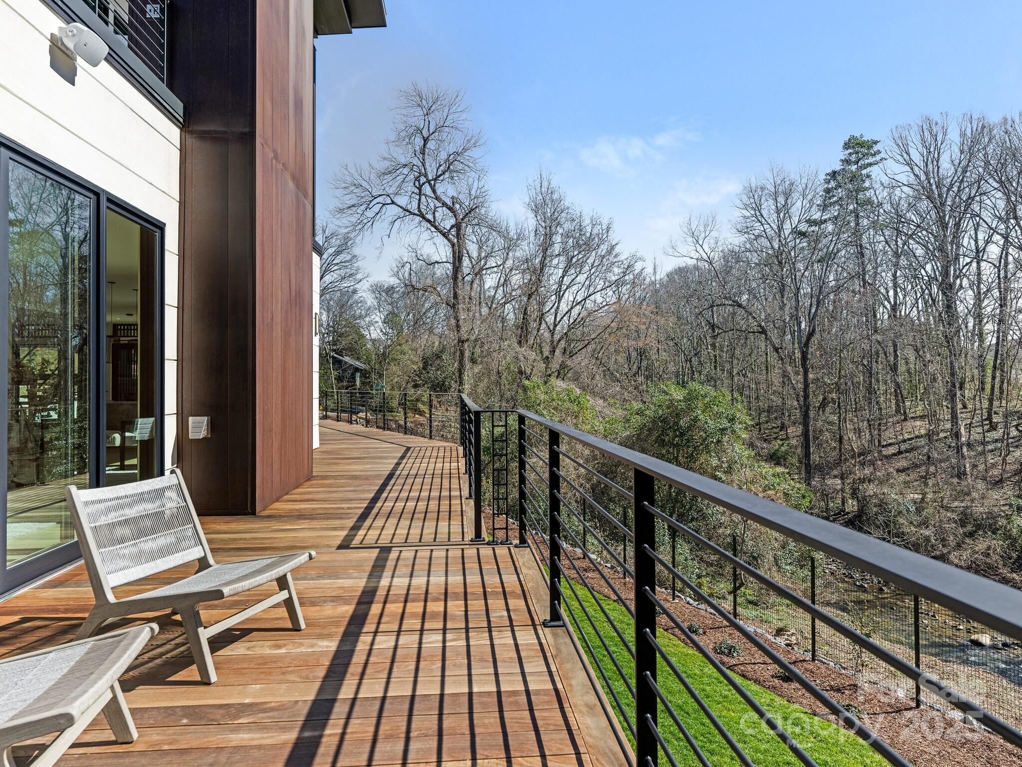 2832 Arcadia Avenue Charlotte, NC 28209 - Photo 42 of 48 a view of balcony with wooden floor and bench