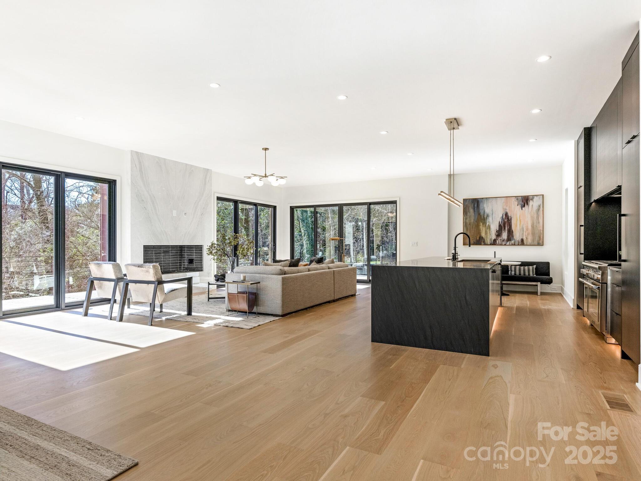 2832 Arcadia Avenue Charlotte, NC 28209 - Photo 10 of 48 a living room with furniture and a flat screen tv