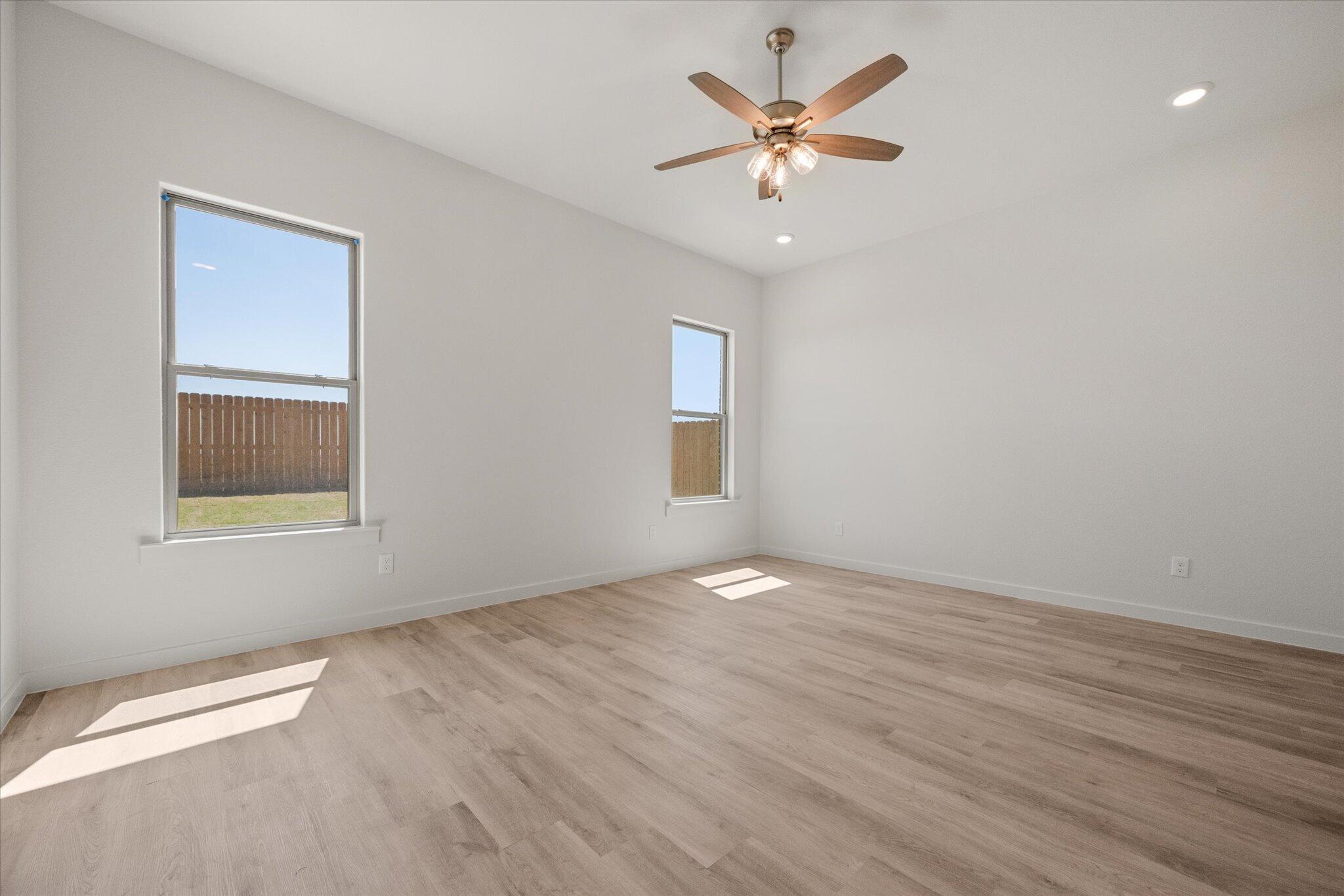 6105 121st Street Lubbock, TX 79424 - Photo 14 of 24 a view of an empty room with a window