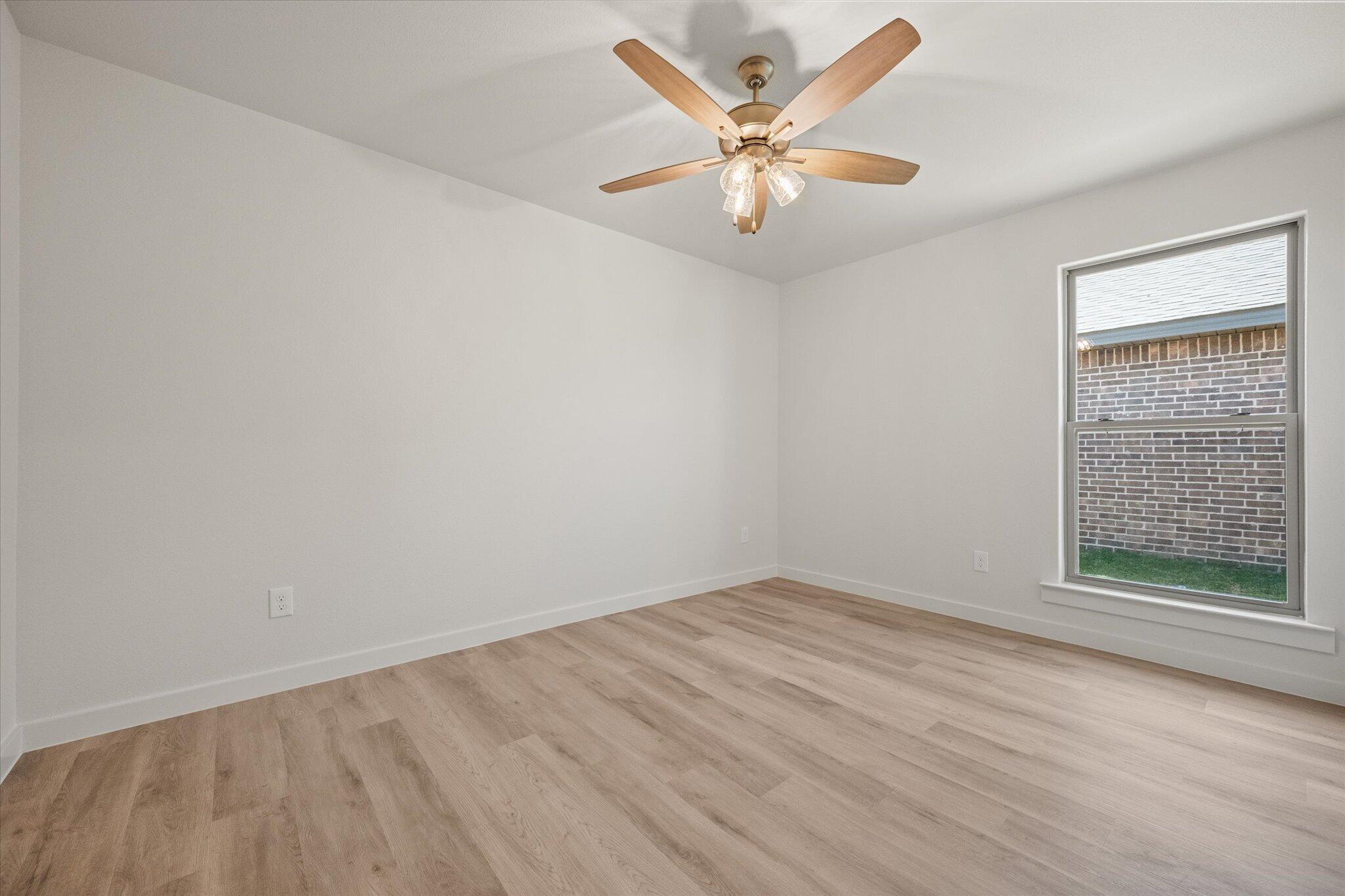 6105 121st Street Lubbock, TX 79424 - Photo 21 of 24 an empty room with a window