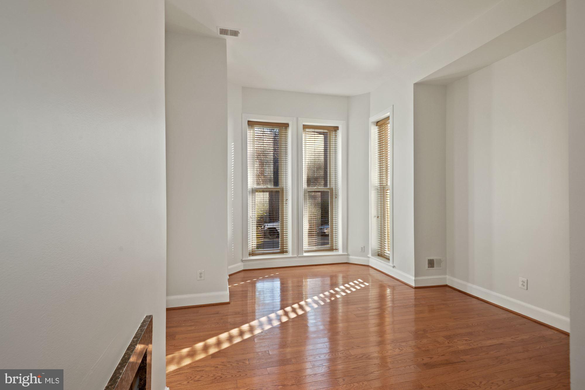 1305 P Street Northwest, Unit 1 Washington, DC 20005 - Photo 5 of 22 Living room with bay window and lots of light.