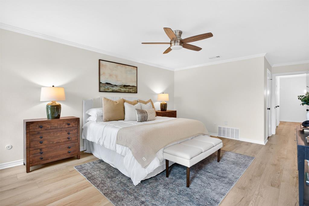 4316 Winding Way Benbrook, TX 76126 - Photo 19 of 40 a bedroom with a bed and ceiling fan