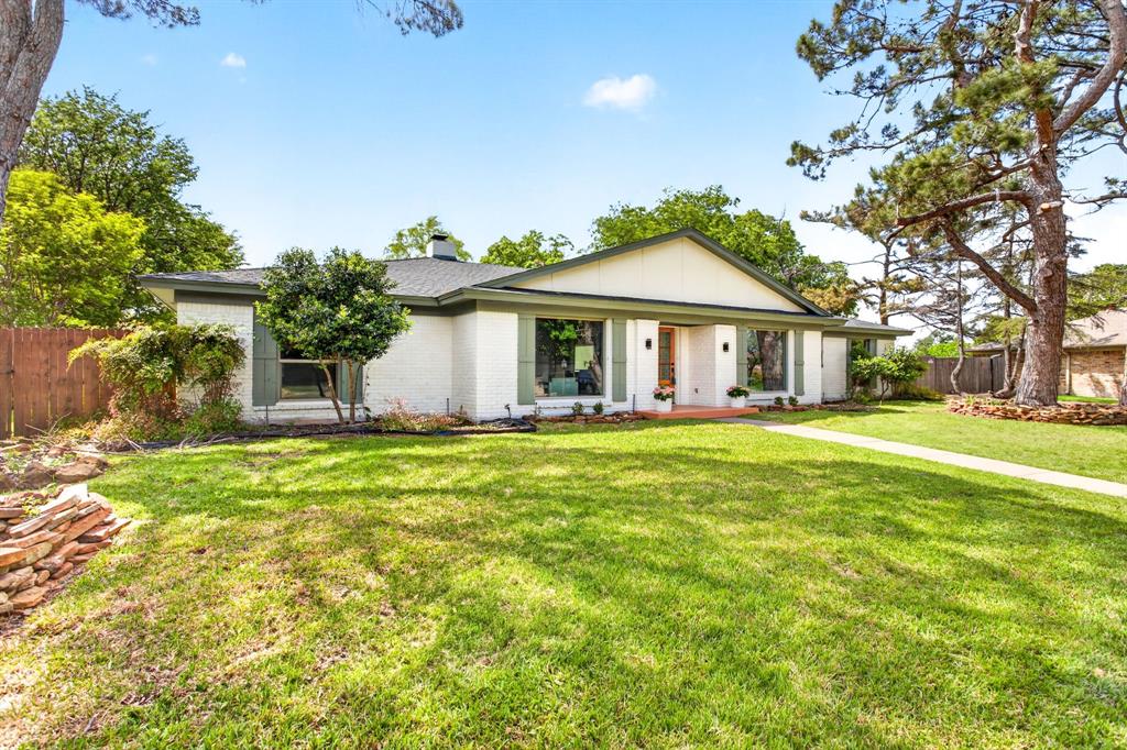4316 Winding Way Benbrook, TX 76126 - Photo 2 of 40 a front view of a house with a garden