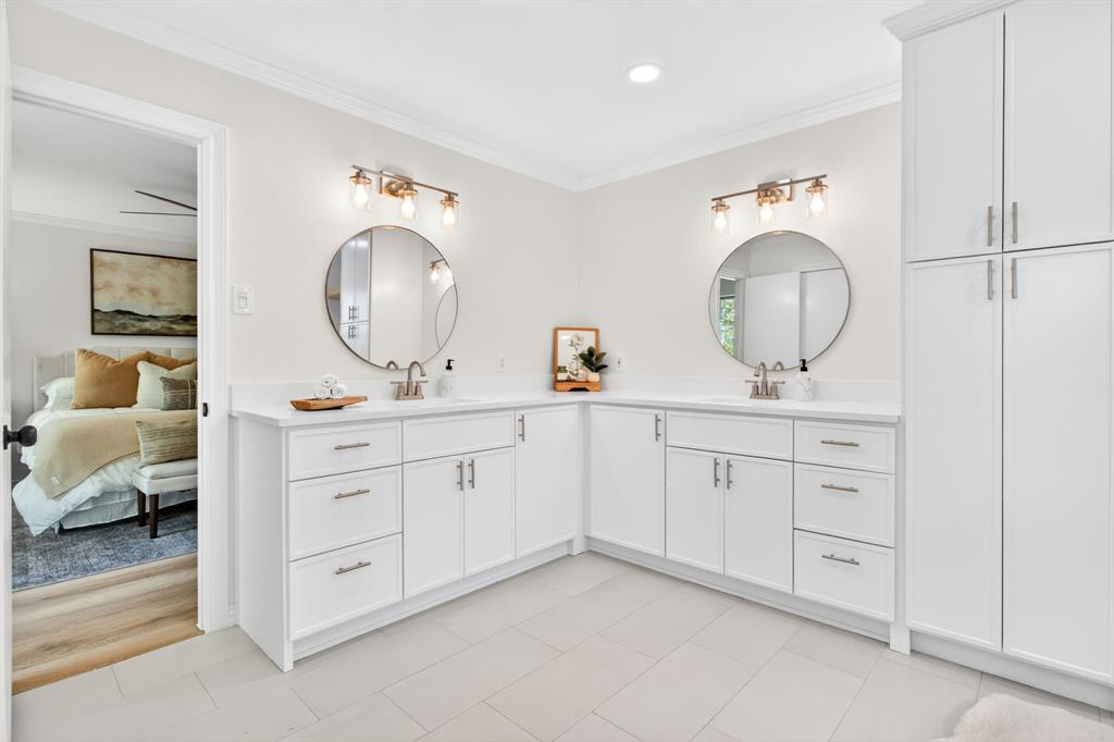 4316 Winding Way Benbrook, TX 76126 - Photo 21 of 40 a en suite bathroom with 2 sink and a mirror