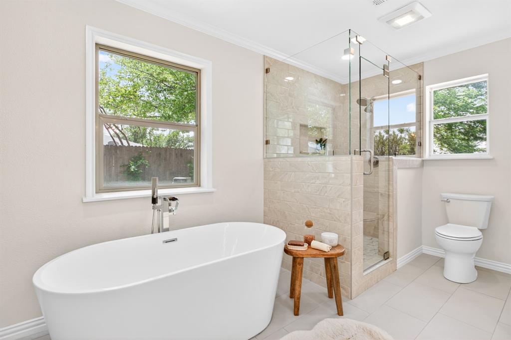 4316 Winding Way Benbrook, TX 76126 - Photo 24 of 40 a white bath tub sitting next to a white toilet