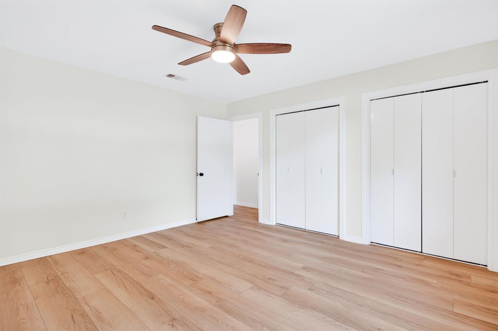 4316 Winding Way Benbrook, TX 76126 - Photo 30 of 40 an empty room with wooden floor fan and windows