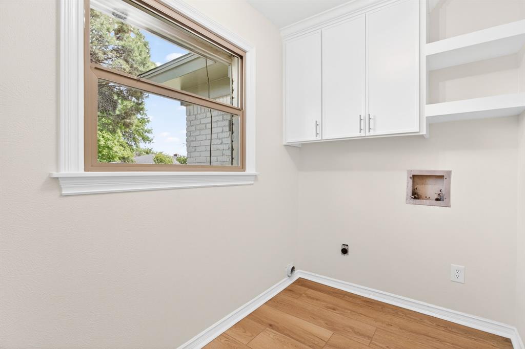 4316 Winding Way Benbrook, TX 76126 - Photo 31 of 40 a view of a small space with wooden floor and a window