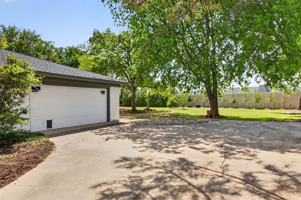 4316 Winding Way Benbrook, TX 76126 - Photo 36 of 40 a view of a yard with plants and trees