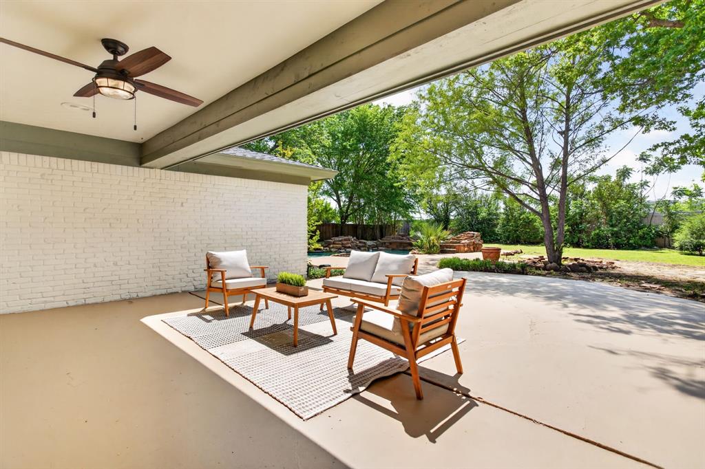 4316 Winding Way Benbrook, TX 76126 - Photo 37 of 40 a view of a patio with a table and chairs