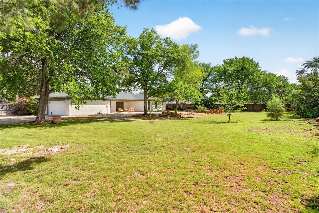 4316 Winding Way Benbrook, TX 76126 - Photo 38 of 40 a front view of a house with a big yard