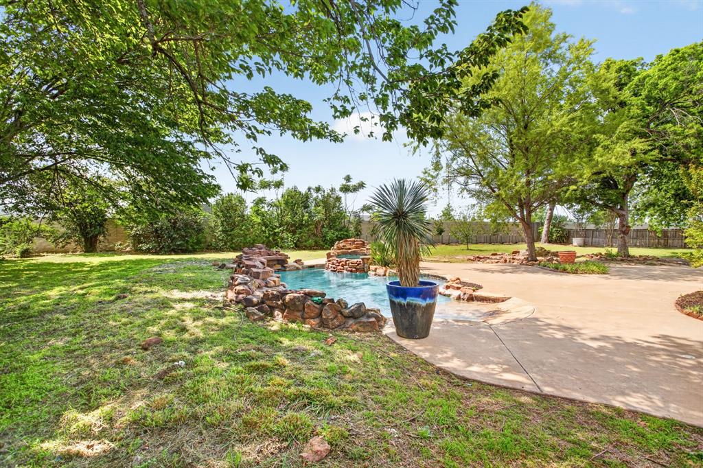 4316 Winding Way Benbrook, TX 76126 - Photo 39 of 40 a view of yard with swimming pool and green space