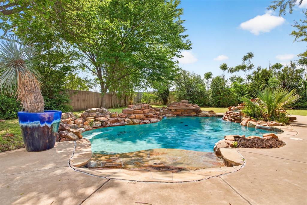 4316 Winding Way Benbrook, TX 76126 - Photo 40 of 40 a view of a backyard with plants and outdoor seating