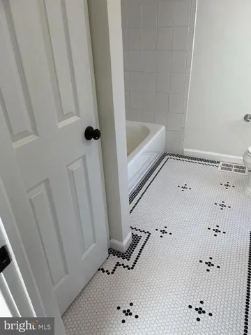 a bathroom with a bathtub