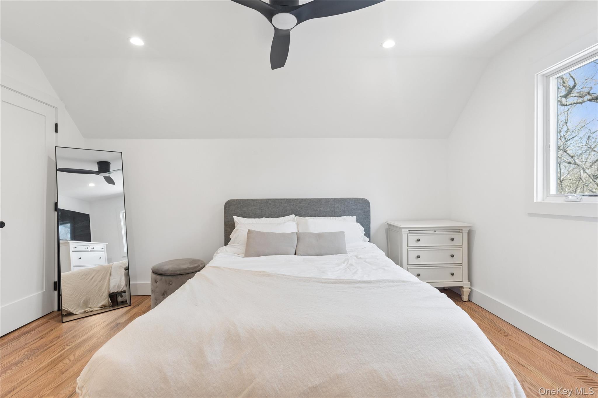 502 Springs Fireplace Road East Hampton, NY 11937 - Photo 12 of 25 a bedroom with a bed and wooden floor