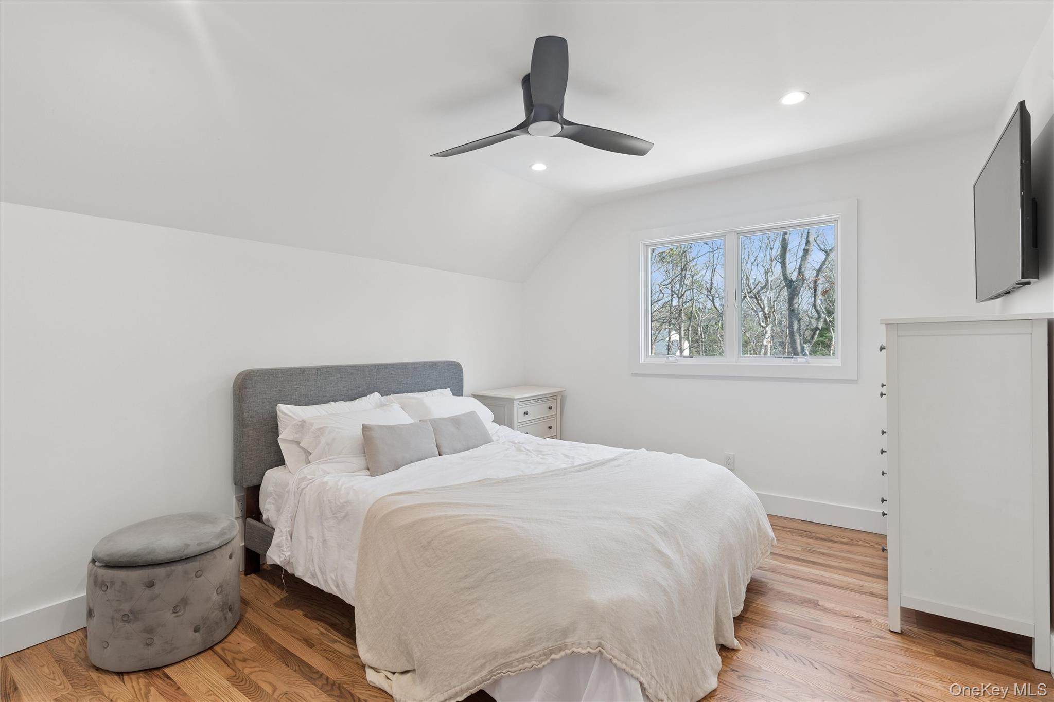 502 Springs Fireplace Road East Hampton, NY 11937 - Photo 13 of 25 a bedroom with a bed and wooden floor