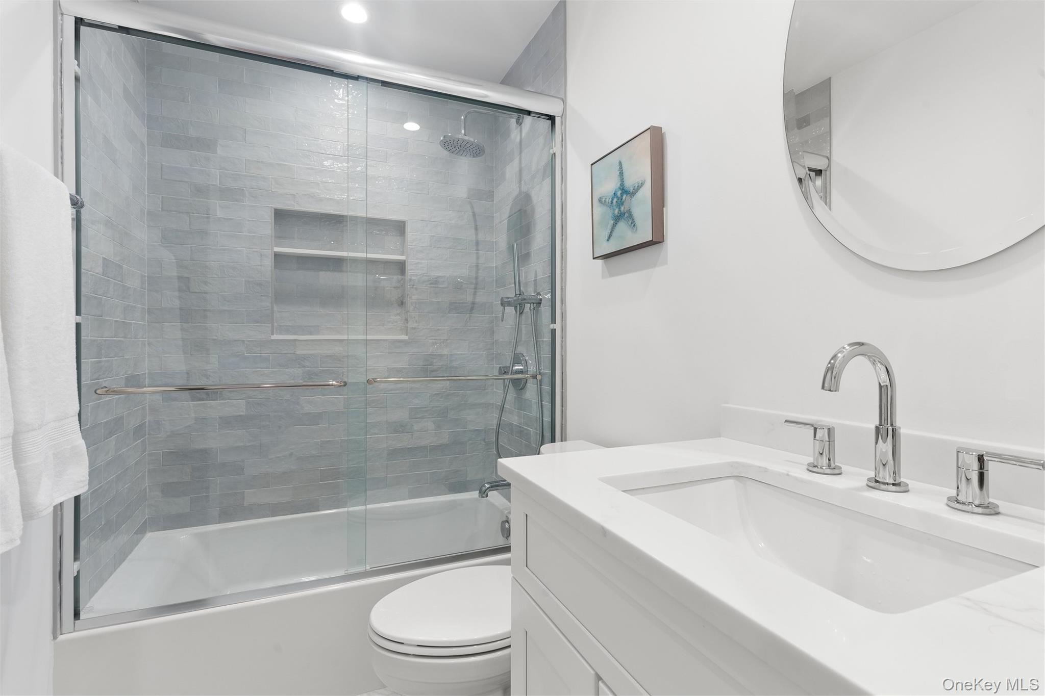 502 Springs Fireplace Road East Hampton, NY 11937 - Photo 17 of 25 a bathroom with a granite countertop sink mirror toilet and bathtub