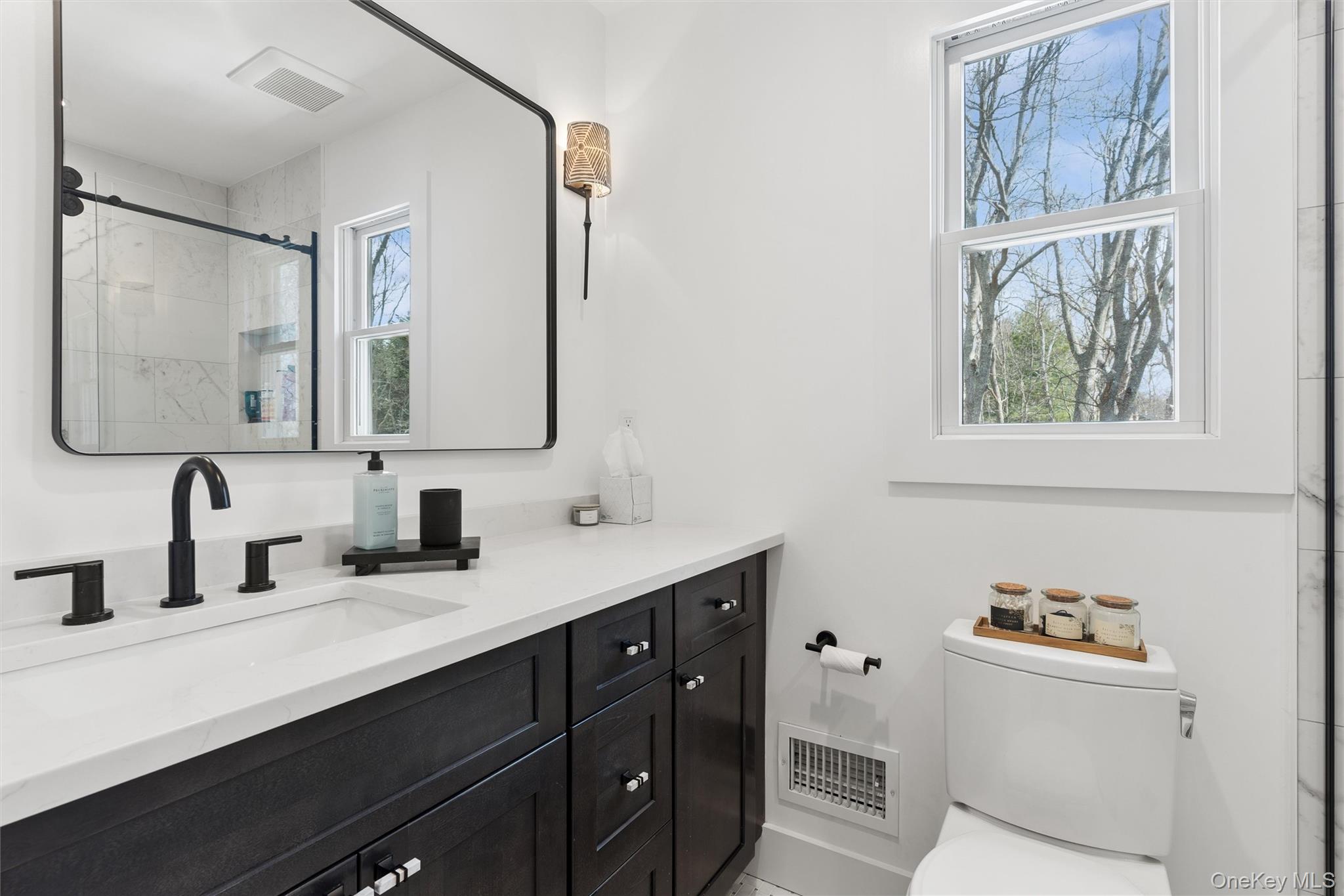 502 Springs Fireplace Road East Hampton, NY 11937 - Photo 18 of 25 a bathroom with a double vanity sink mirror and