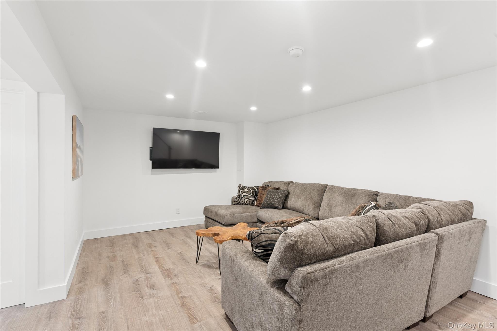 502 Springs Fireplace Road East Hampton, NY 11937 - Photo 20 of 25 a living room with furniture and a flat screen tv