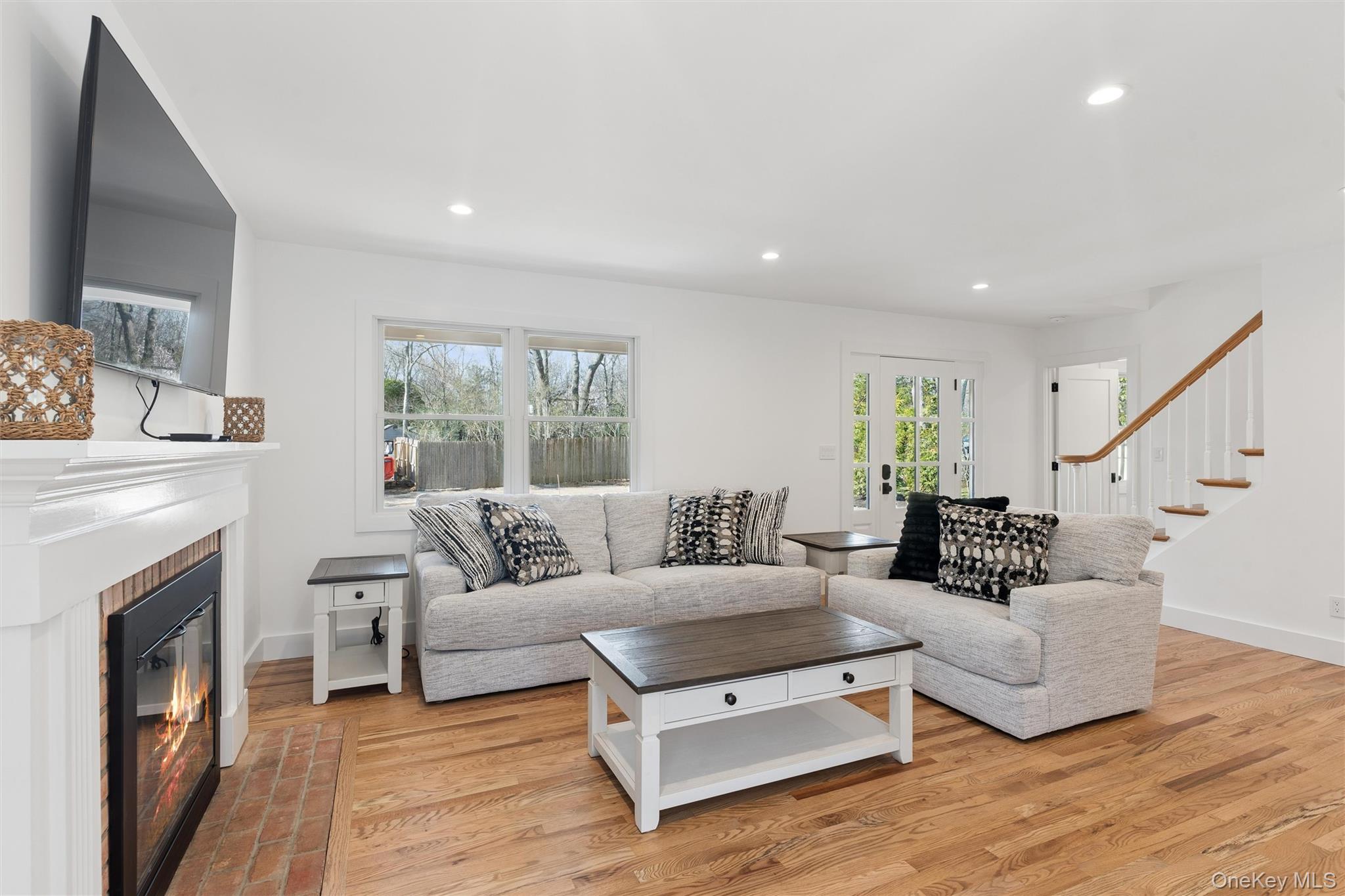 502 Springs Fireplace Road East Hampton, NY 11937 - Photo 3 of 25 a living room with furniture and a fireplace