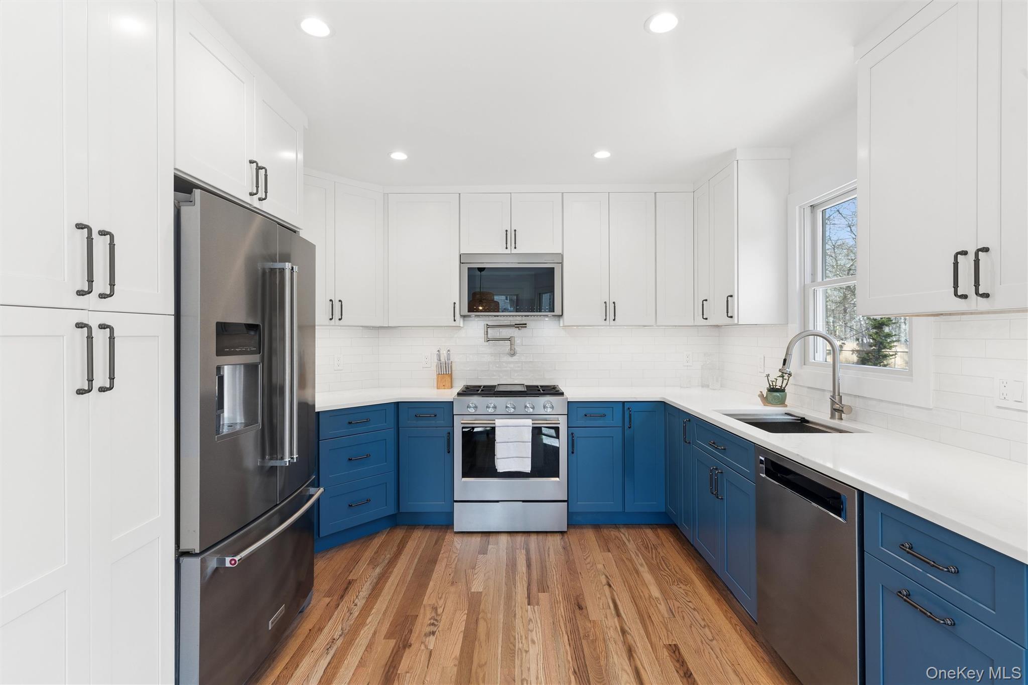 502 Springs Fireplace Road East Hampton, NY 11937 - Photo 6 of 25 a kitchen with stainless steel appliances granite countertop a refrigerator stove and sink