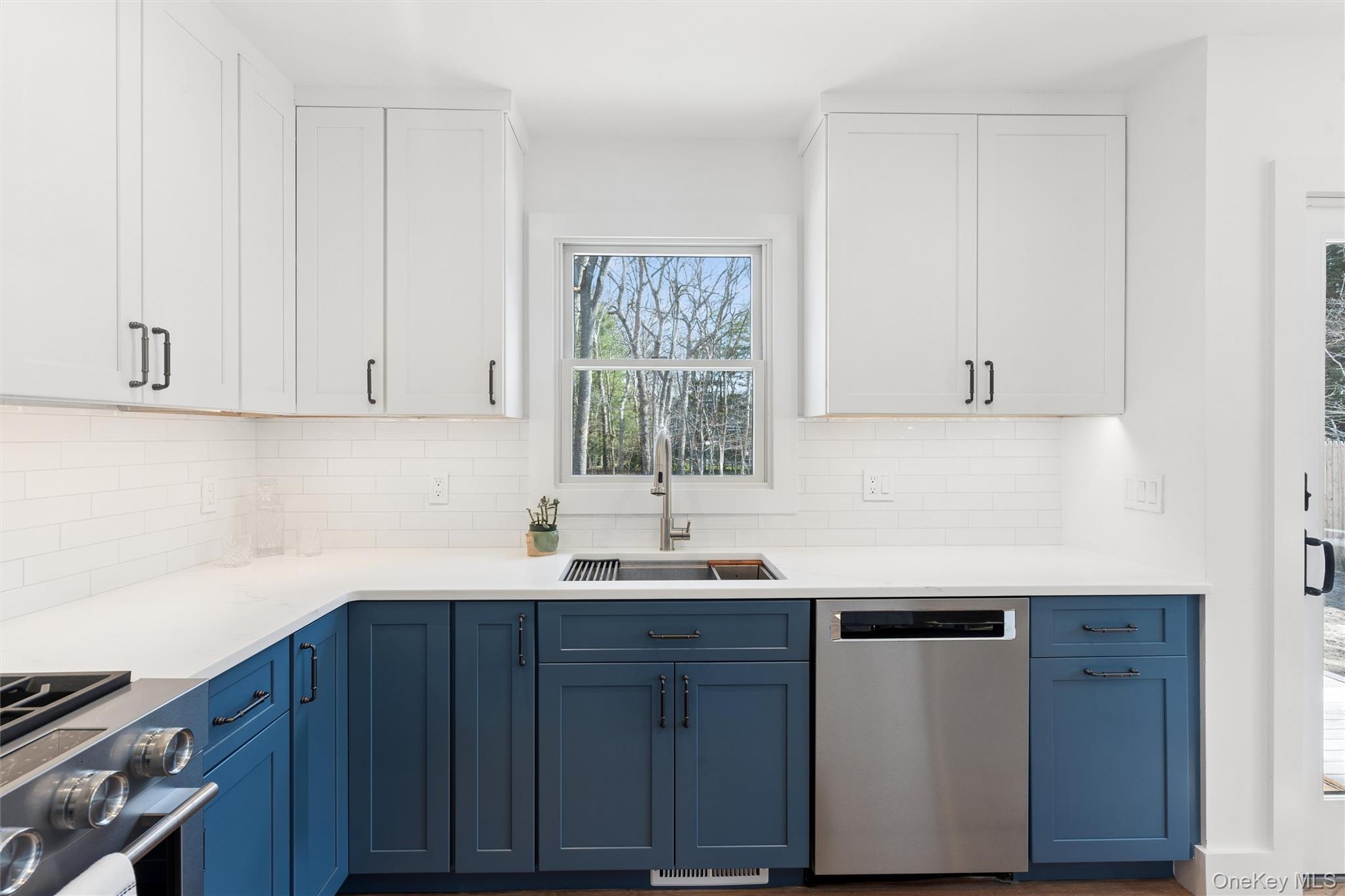 502 Springs Fireplace Road East Hampton, NY 11937 - Photo 8 of 25 a kitchen with a sink and cabinets