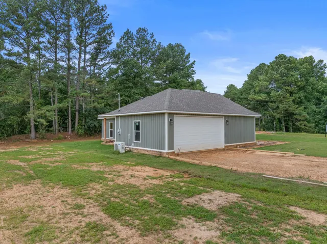 a house that has sitting area in front of it