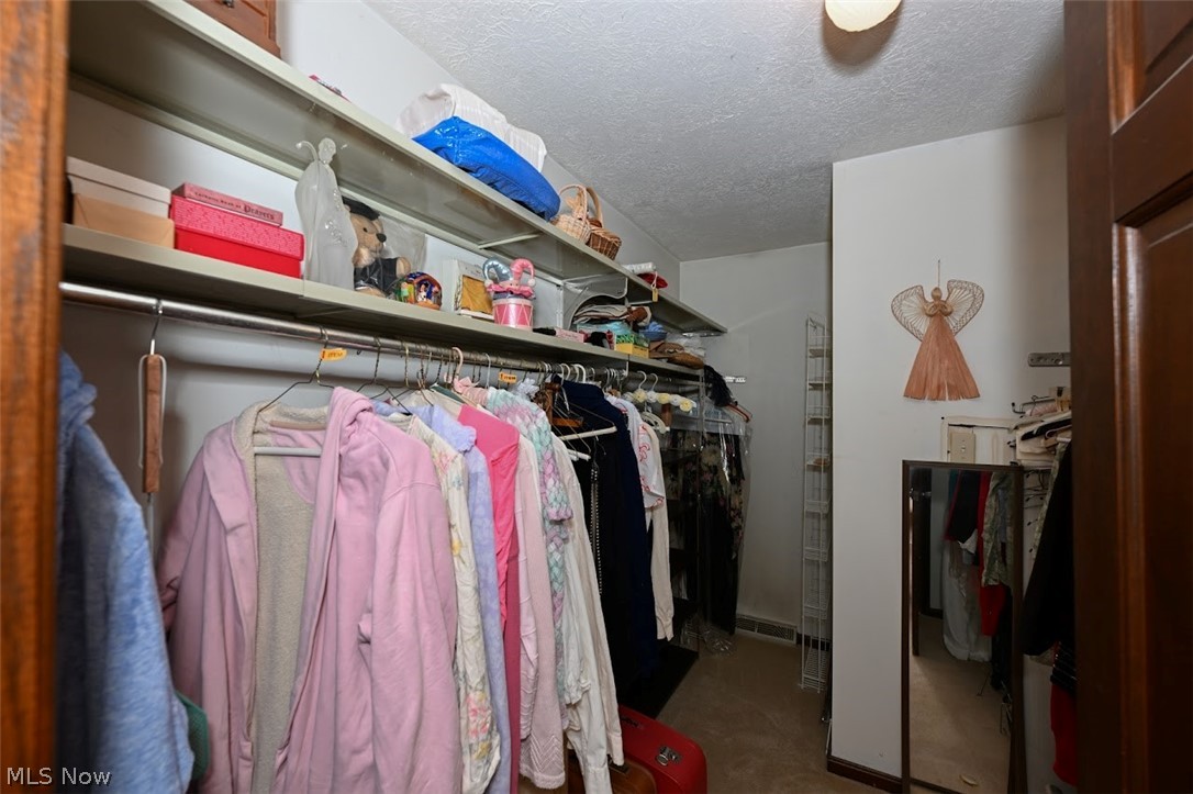 758 Inverness Road Akron, OH 44313 - Photo 27 of 46 View of walk in closet in owner's bedroom