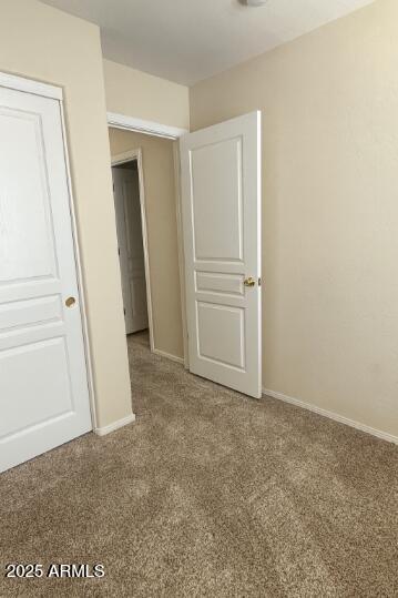23150 West Lasso Lane Buckeye, AZ 85326 - Photo 6 of 10 an empty room with windows