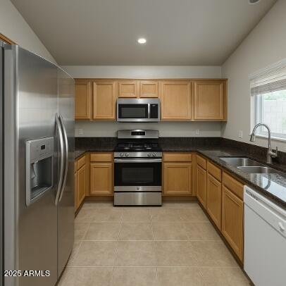 23150 West Lasso Lane Buckeye, AZ 85326 - Photo 8 of 10 a kitchen with stainless steel appliances granite countertop a stove a sink and a refrigerator