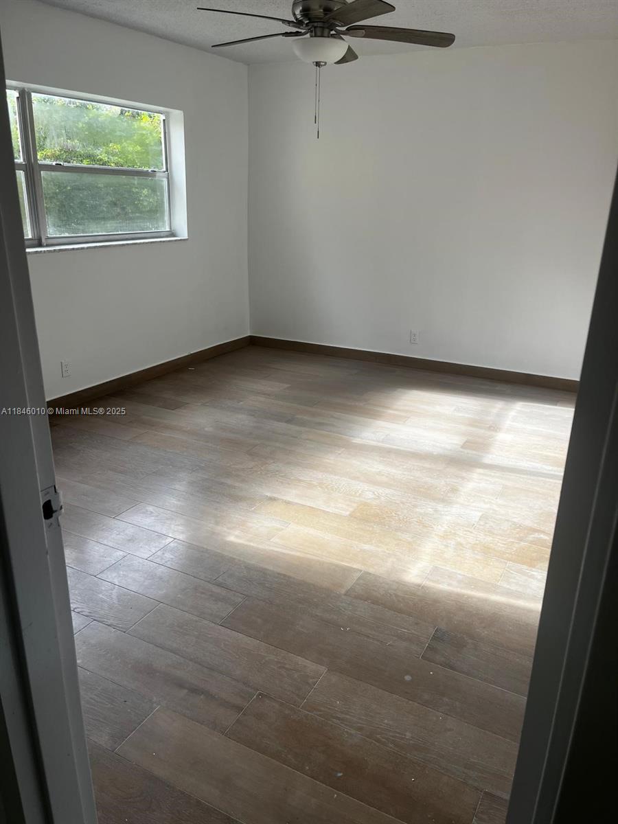 1015 Country Club Drive, Unit 302 Margate, FL 33063 - Photo 4 of 9 a view of room and window