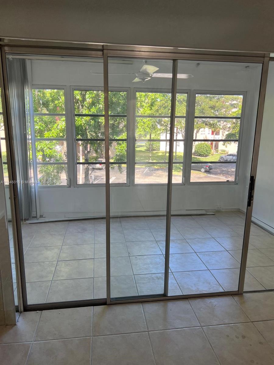 1015 Country Club Drive, Unit 302 Margate, FL 33063 - Photo 9 of 9 a view of an empty room with a window