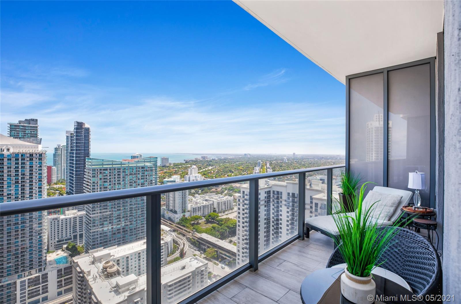 45 Southwest 9th Street, Unit 4204 Miami, FL 33130 - Photo 21 of 66 a view of a balcony with furniture