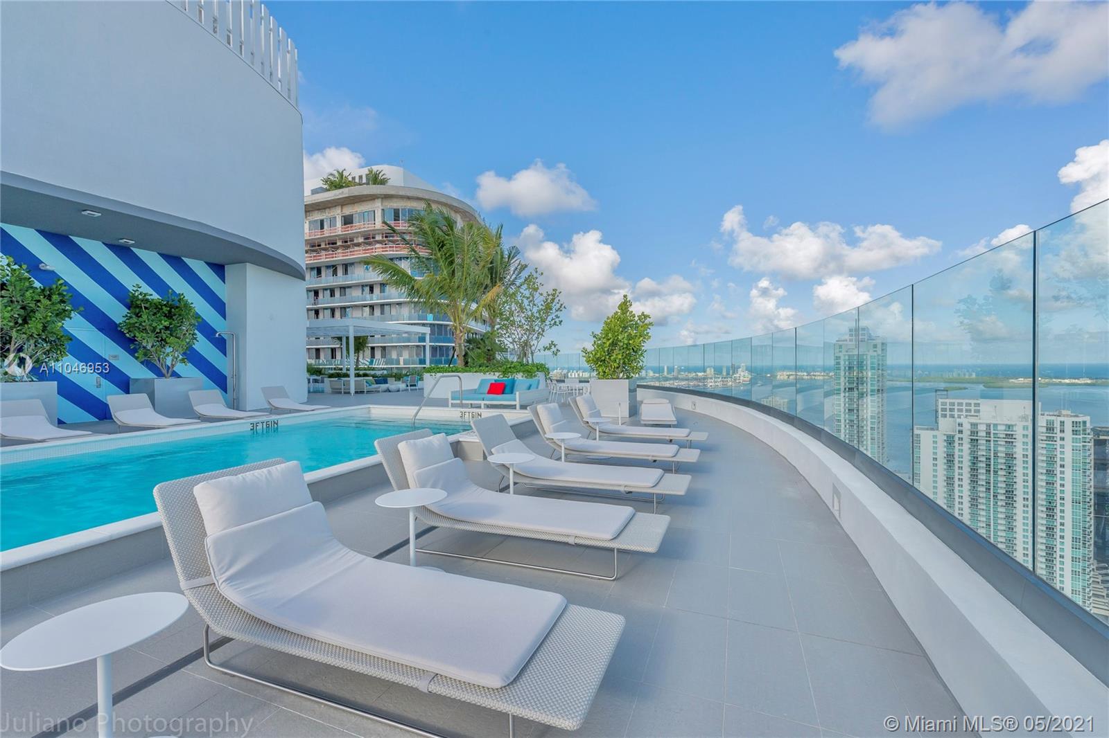 45 Southwest 9th Street, Unit 4204 Miami, FL 33130 - Photo 34 of 66 a view of a patio with couches and table and chairs with plants