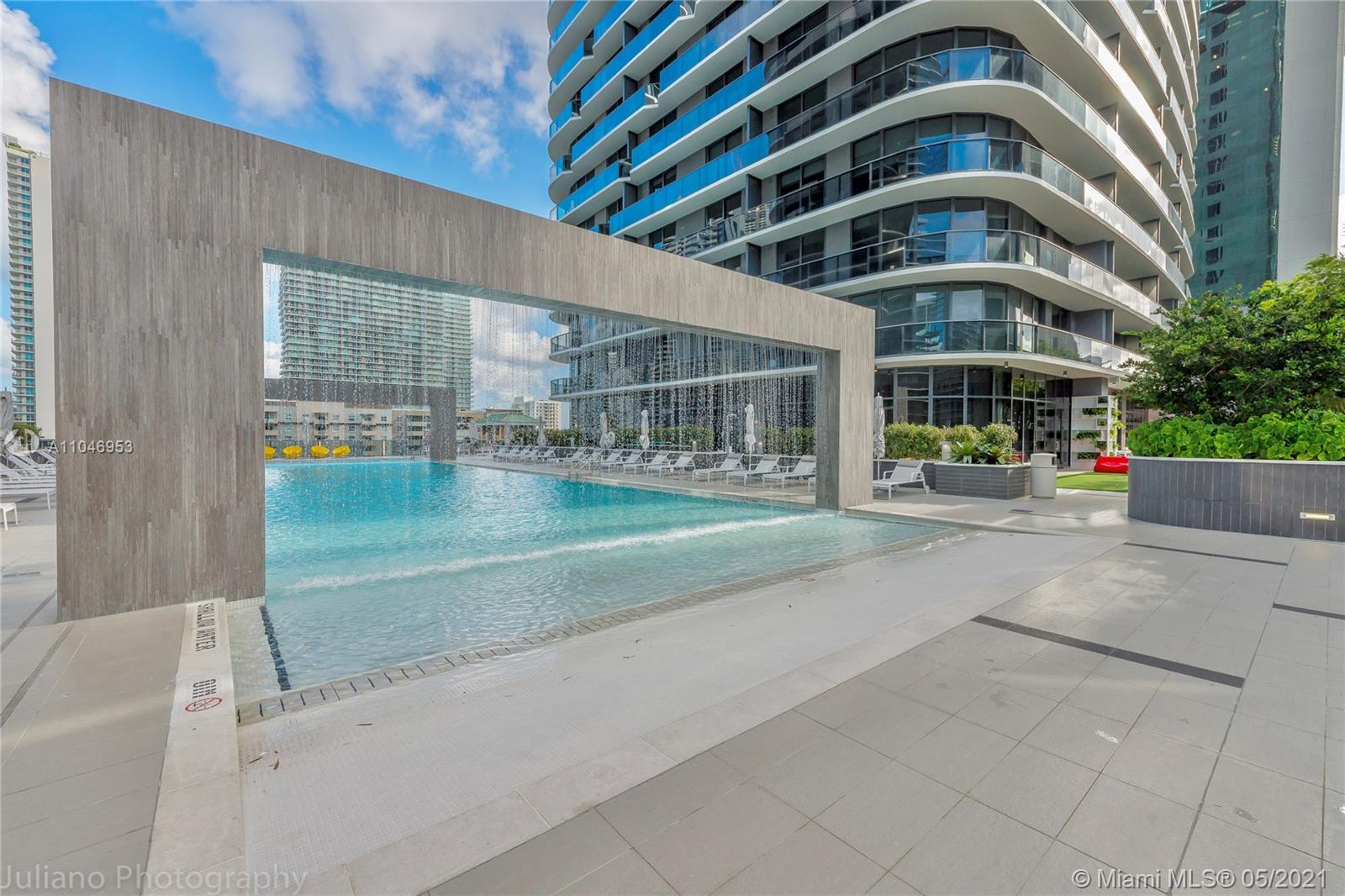 45 Southwest 9th Street, Unit 4204 Miami, FL 33130 - Photo 47 of 66 a view of building with an outdoor space and seating