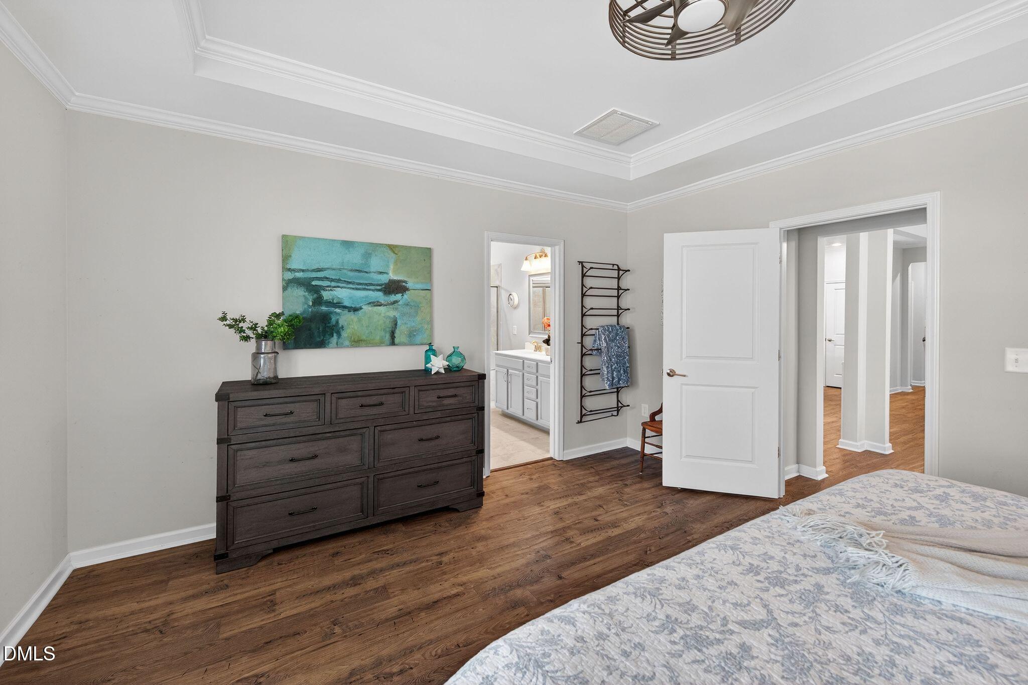 528 Spring Flower Court Cary, NC 27511 - Photo 24 of 51 a room with a bed and a dresser