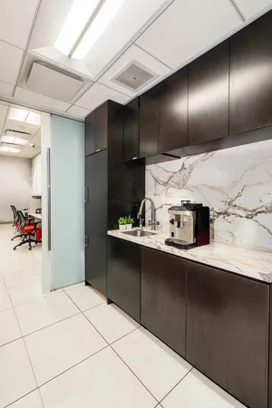 a kitchen with a sink and cabinets