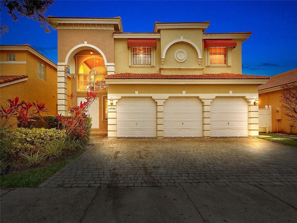 12980 Southwest 52nd Street Miramar, FL 33027 - Photo 1 of 17 a view of a door of a house