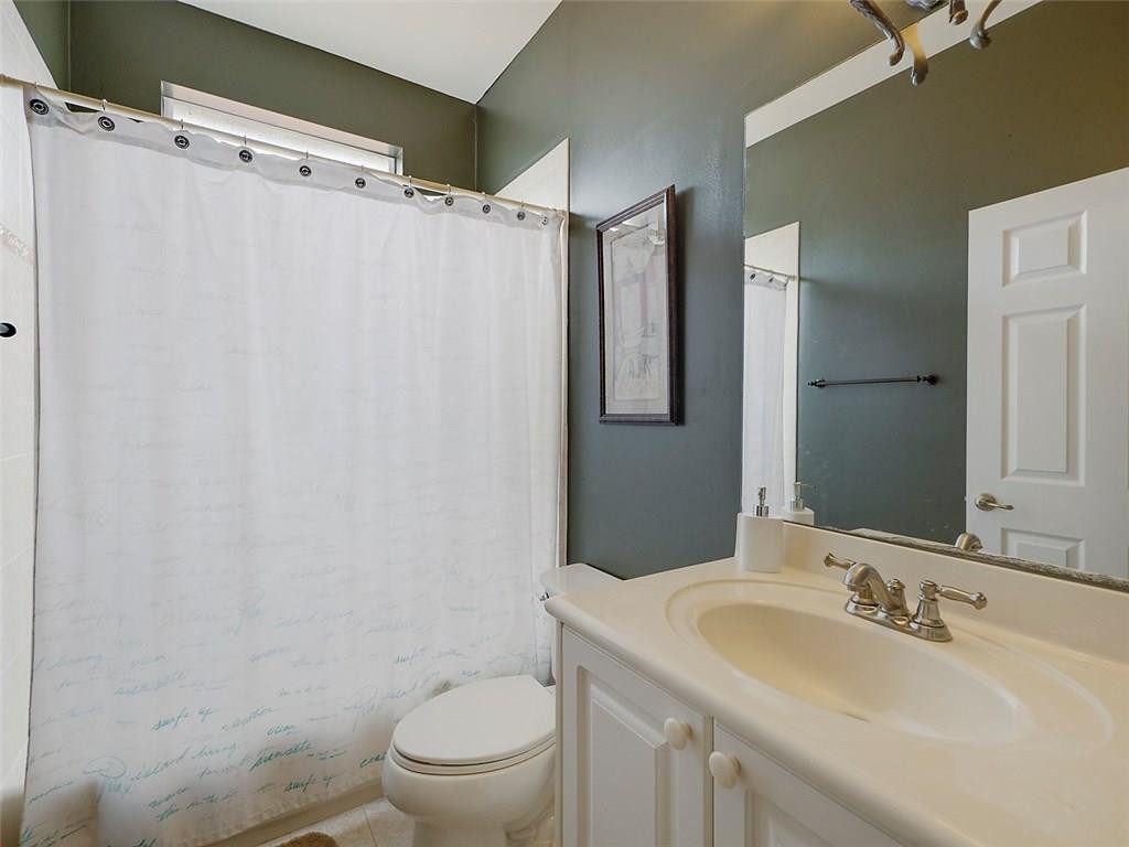 12980 Southwest 52nd Street Miramar, FL 33027 - Photo 12 of 17 a bathroom with a sink toilet and shower
