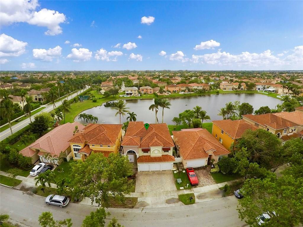 12980 Southwest 52nd Street Miramar, FL 33027 - Photo 14 of 17 an aerial view of residential houses with outdoor space and ocean view