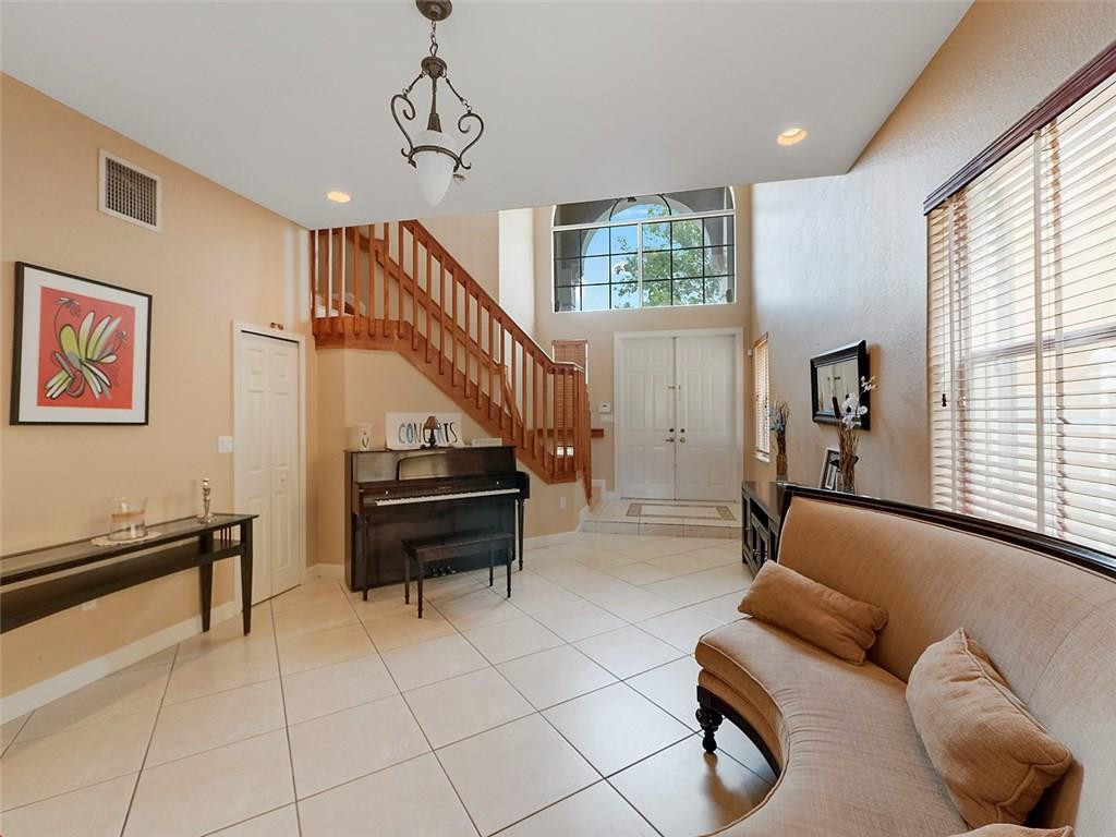 12980 Southwest 52nd Street Miramar, FL 33027 - Photo 3 of 17 a living room with furniture and a window